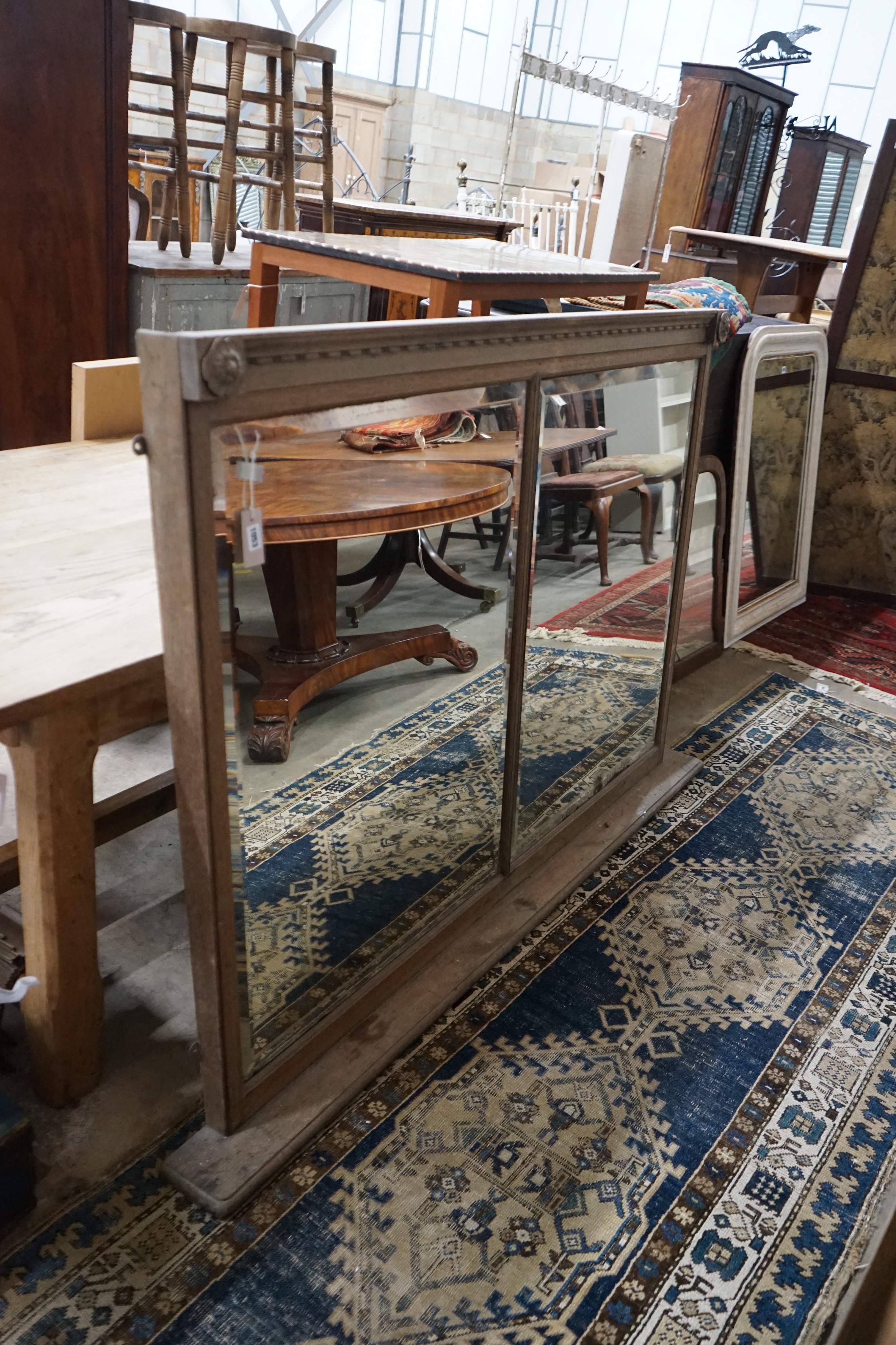 An early 20th century oak framed twin plate overmantel mirror, width 157cm, height 115cm